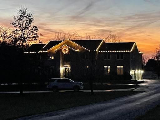Completed Christmas light installation glowing at night